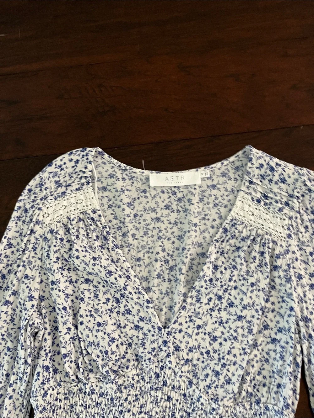 Astr Floral Long-Sleeve Smocked Crop Top in White and Blue